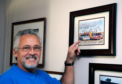 Stu Hayner, in late October, 2009 at his home in Yorba Linda, California with his signed copy of the Record Run Publicity Photo. Image: Author.